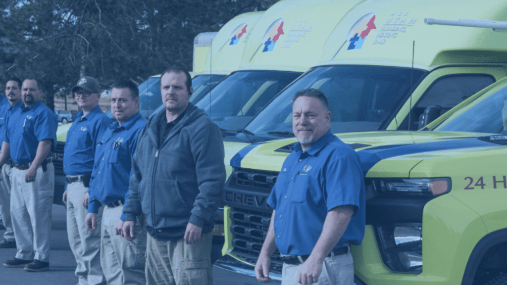 all utah plumbing, heating & air team photo standing outside truck
