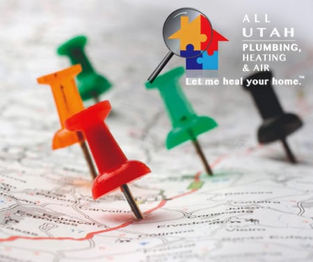 Multi-colored push pins in a map.